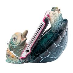 Phone holder shaped like a turtle with a white background