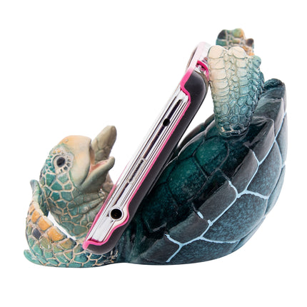 Phone holder shaped like a turtle with a white background