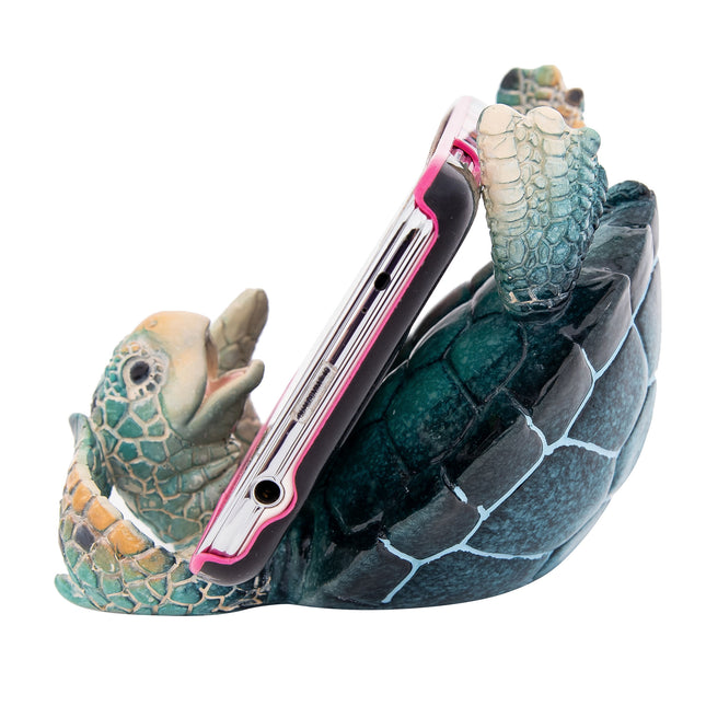 Phone holder shaped like a turtle with a white background