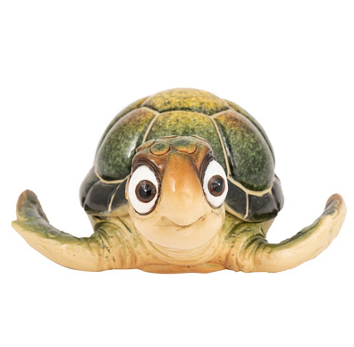 Bright green cartoon turtle figurine with big bug eyes and an opening shell used as a trinket box, displayed as coastal wall art or a decorative tabletop accessory.
